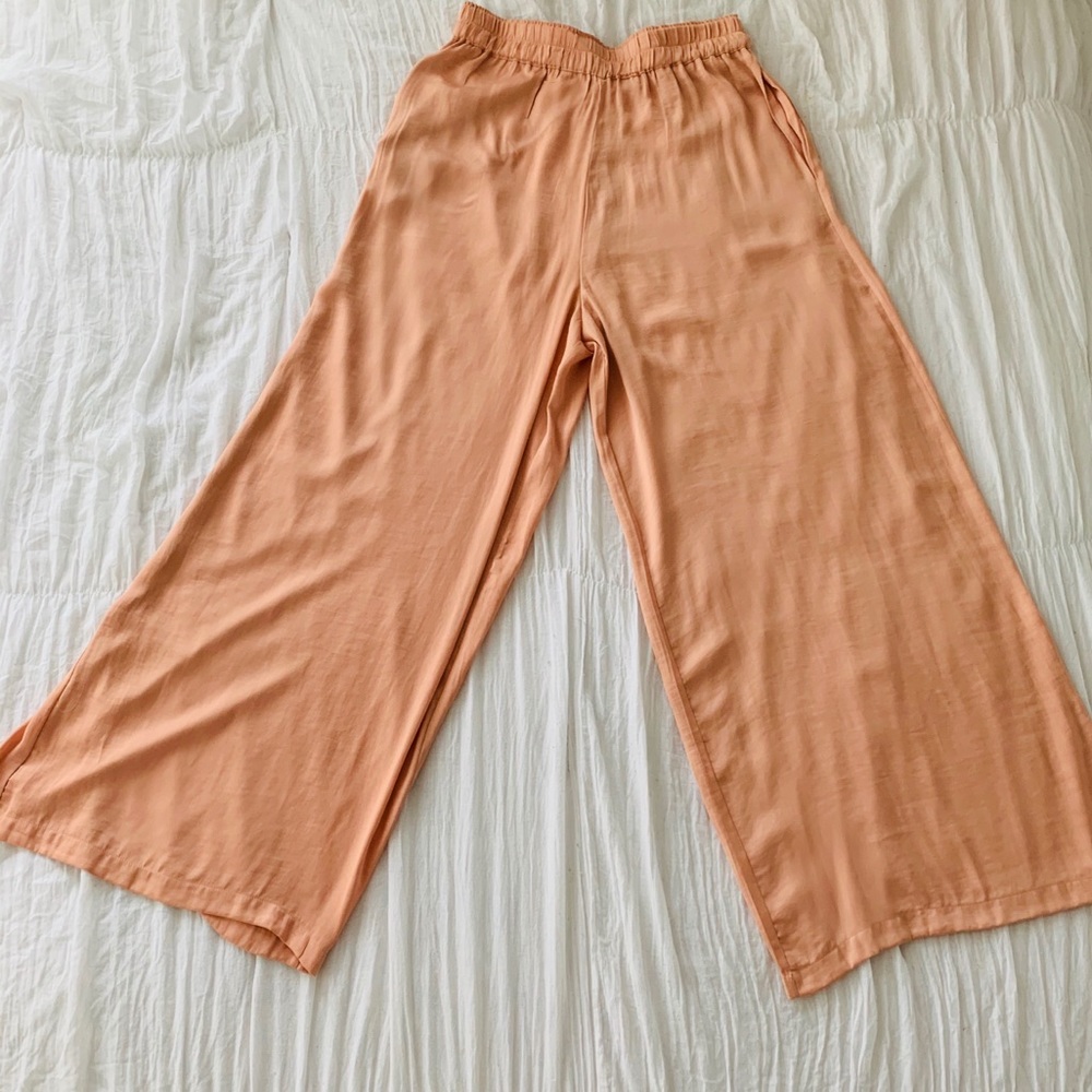 Light coral satin wide leg pants.